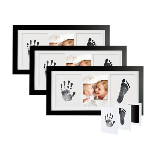 Set of black photo frames with baby hand and footprints on a white background

