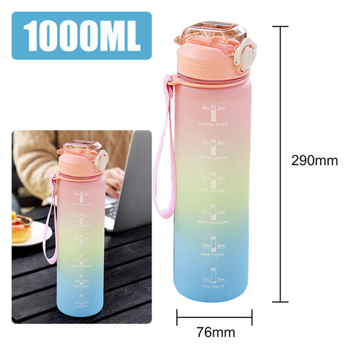 Pink and blue gradient water bottle with ergonomic grip and carry loop.