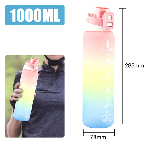 Pink and blue hydration bottle with measurement scale and leakproof lid.