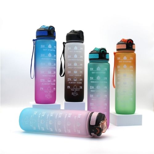 Turquoise and pink motivational water bottle with hydration tracking measurements.