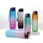 Turquoise and pink motivational water bottle with hydration tracking measurements.