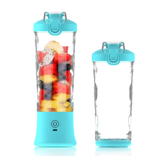Blue portable blender bottle filled with fresh fruit for healthy smoothie preparation