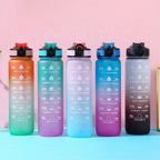 Gradient fitness water bottles in multiple color options with time marker design.