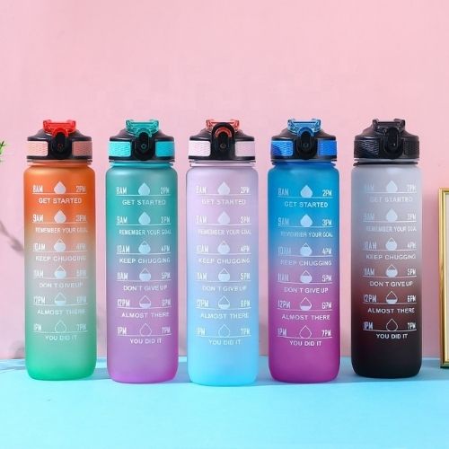 Gradient fitness water bottles in multiple color options with time marker design.