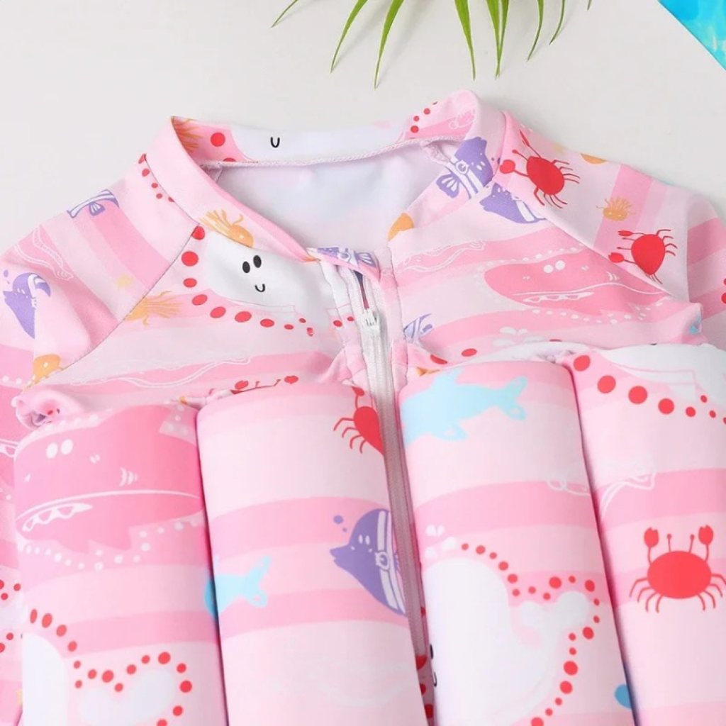 Pink children's jacket with colorful patterns on a white background

