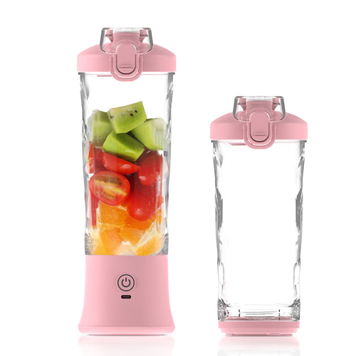 Pink personal blender bottle with fruit ingredients for quick juice blending