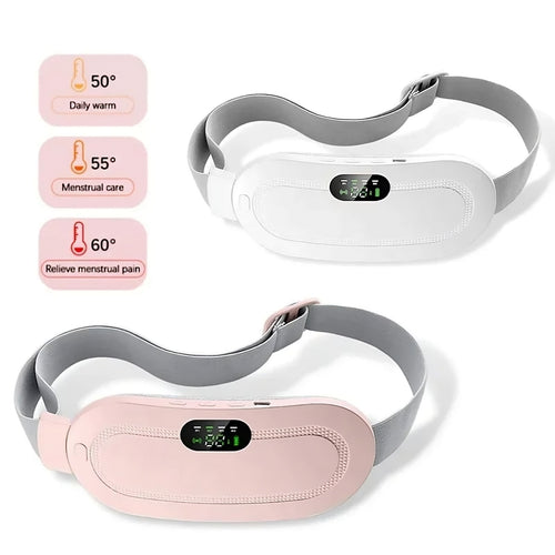 Woman using electric heating and vibration massager for menstrual pain relief