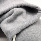 Close-up view of the plush interior fabric of the hooded travel neck pillow.