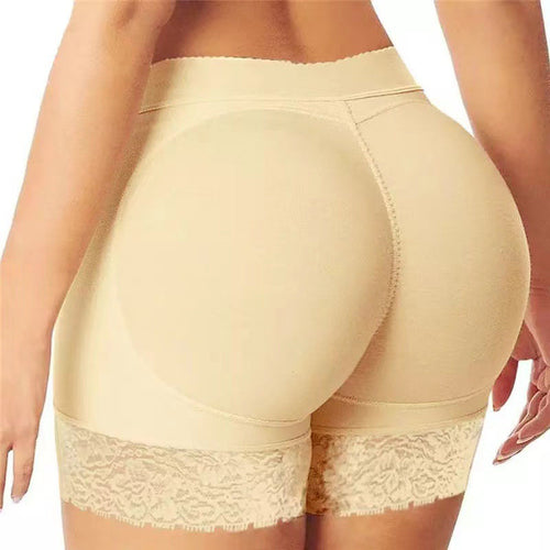 Rear view of beige hip enhancer shorts featuring seamless construction and lace trim.