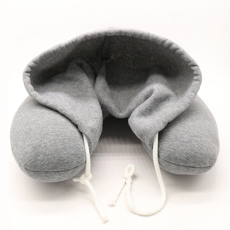 Memory foam hooded neck pillow with adjustable hood for enhanced comfort and support.
