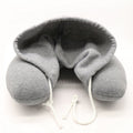 Memory foam hooded neck pillow with adjustable hood for enhanced comfort and support.