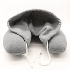 Memory foam hooded neck pillow with adjustable hood for enhanced comfort and support.