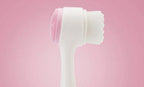 Pink Background Product Shot of Manual Face Cleansing Brush