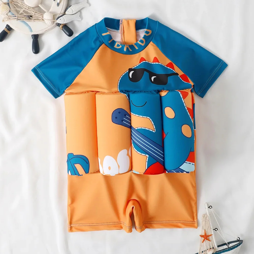 Children's swimsuit with dinosaur design on a white background

