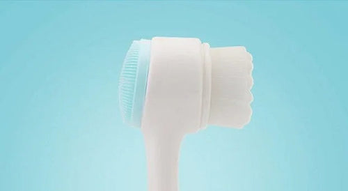 Blue Background Product Shot of Dual-Sided Facial Cleansing Brush
