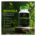 Moringa supplement bottle with green leaves and nature-themed text on a dark background