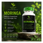 Moringa supplement bottle with green leaves and nature-themed text on a dark background